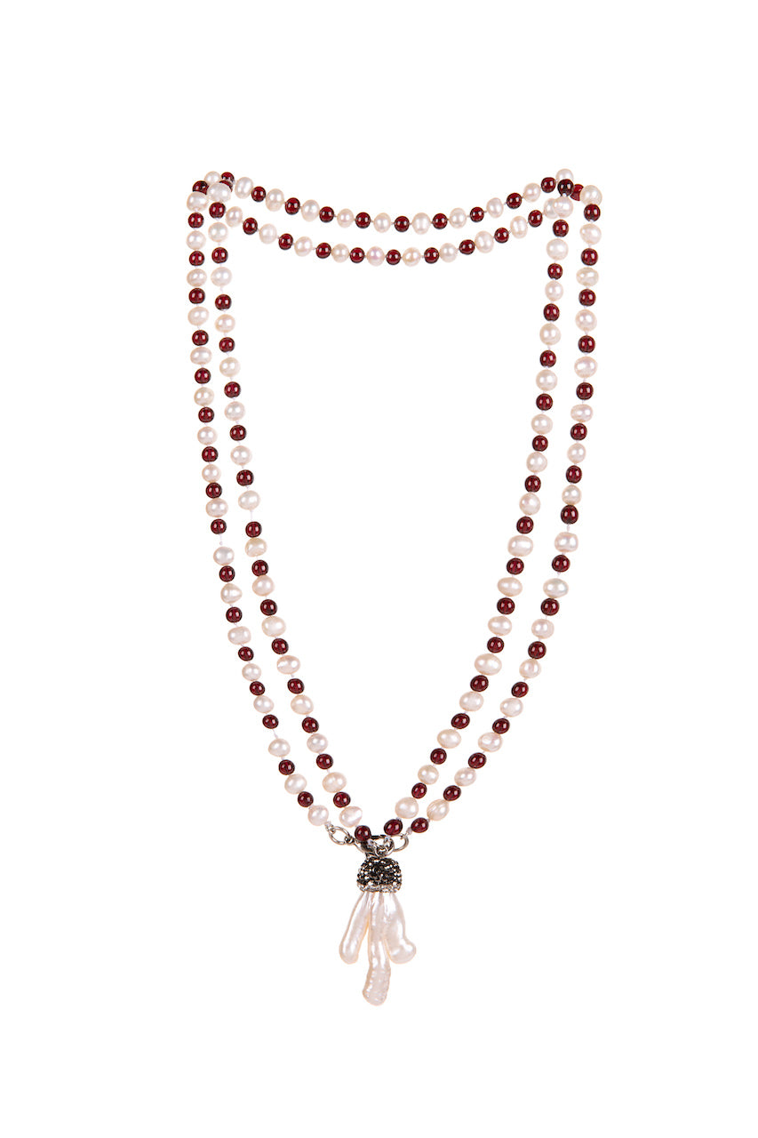 Dynamic combination of warm, passionate, deep red burgundy garnet round stones and freshwater pearls inspired the title: Deep Love. And as with love it can't be without that 'special touch'. In this case it is a charm made of brass and organic shape keishi pearl. You can wear it as a long single necklace, usual length double or choker style triple necklace.