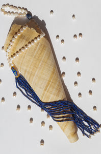 Treat yourself with this necklace and our hero combination of delicate cascade of faceted lapis lazuli beads with golden strings that add to its quality. Freshwater pearls casted with an decadent touch pf gold plated silver Chinese enamel