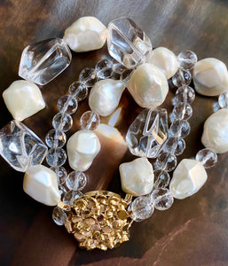 The bracelet made of crystal clear quartz and baroque pearls brings the sparkling joy and freshness. The unique gold plated silver clasp makes this piece made for the keeps